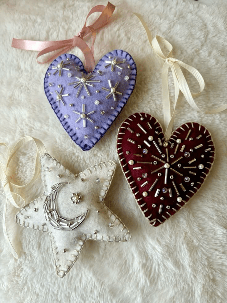 hand-made felt beaded ornaments in the shape of a heart and a star